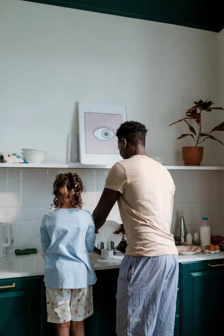 Home Ec skills: father and daughter doing dishes