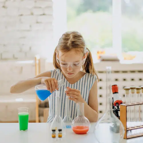 ways to test your child - girl with science beakers